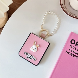 Pink leather Galaxy Z Flip 6 case with 3D bunny decor and pearl wristlet strap