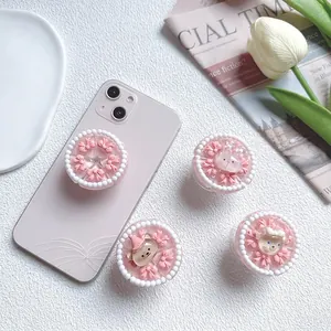 Cute pink 3D cake design phone grip with bow, bear and rabbit figures on pink phone
