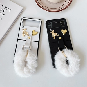 Luxury Samsung Z Flip4 case with metal bear heart charms and large plush fur ball strap