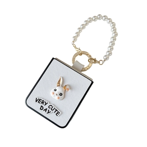 White leather phone case for Samsung Z Flip 6 with pearl chain and cute rabbit decor