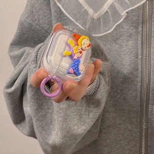 Cute transparent AirPods case featuring 3D cartoon dolls and a purple ring hook strap