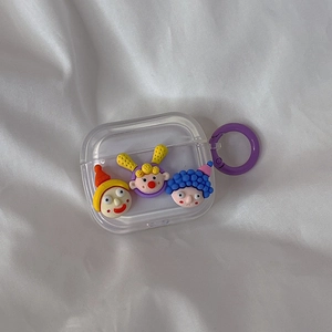 Transparent AirPods case featuring cute 3D cartoon charms and a purple round clip hook