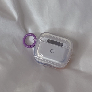Detailed view of transparent AirPods case with purple spring clip on white fabric