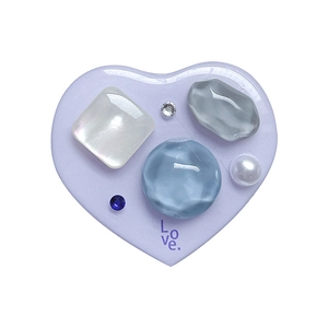 Heart-shaped expanding phone grip with purple Love text, pearls, and colorful rhinestones