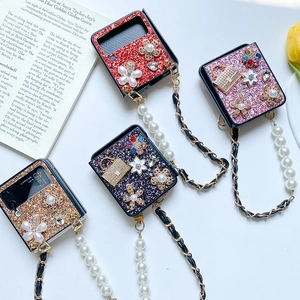 Detail of luxury glitter phone case for Galaxy Z Flip6 with pearl flowers and metal chain