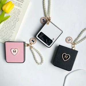 Leather folding phone case for Z Flip with pearl handle and heart bow design