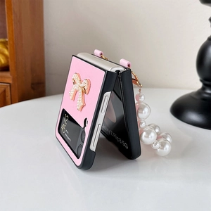 Pink lychee leather texture Z Flip case with pearl bow and elegant pearl hand chain