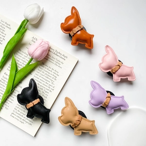 5pcs Foldable leather bulldog phone socket grips in vibrant colors on a white desk