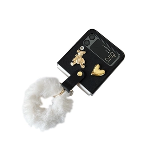 Samsung Z Flip4 case with black leather texture, golden bear charm and white plush pompom