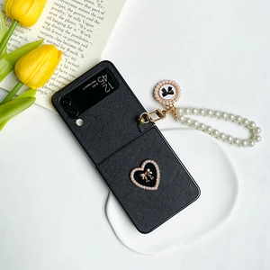 Detail of Saffiano leather phone case with pearl handle and heart bow for Samsung Z Flip