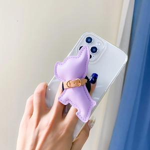 Detail of lavender leather puppy phone grip with fine stitching on white smartphone