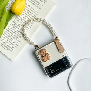 Detail of Galaxy Z Flip 6 case with 3D bear motif and faux pearl handle strap