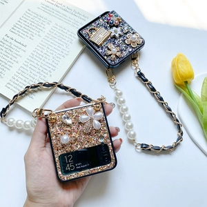 Detail of Galaxy Z Flip 6 case with pearl floral sequins and luxury metal strap