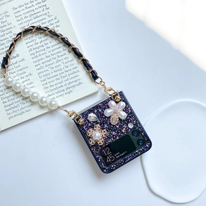 Detail of Galaxy Z Flip 6 case featuring floral rhinestones and pearl chain strap