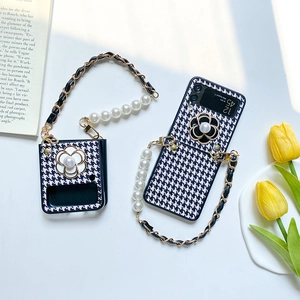 Detail of Z Flip case with houndstooth pattern, camellia flower and pearl crossbody strap