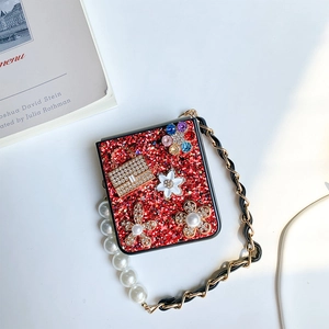 Detailed view of red sequin Samsung Z Flip 6 case with floral rhinestones and pearl strap