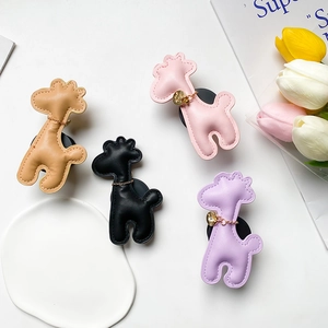 Expandable giraffe phone socket grip in beige, black, pink and purple faux leather