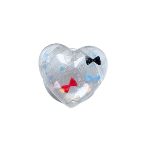Clear heart phone grip with floating colorful bows and glitter for aesthetic look
