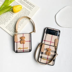 Plaid leather case for Samsung Z Flip 4 featuring a cute bear charm and wrist strap