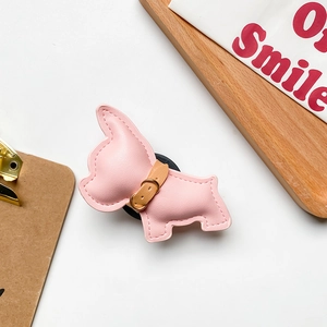 Detail of pink French Bulldog phone socket showing PU leather texture and stitching
