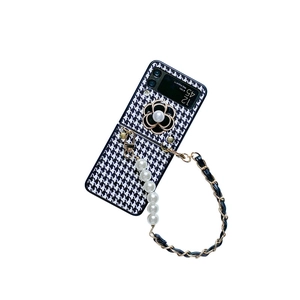 Samsung Z Flip case with houndstooth pattern, pearl handle, camellia, and crossbody chain