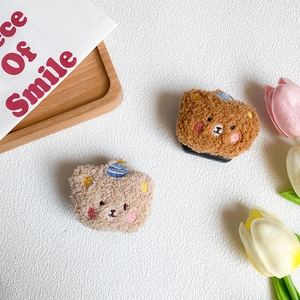 Detail of plush bear phone socket with soft lamb wool texture and hidden makeup mirror