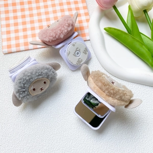 Detailed view of the foldable plush sheep phone stand with integrated mirror and 3M adhesive