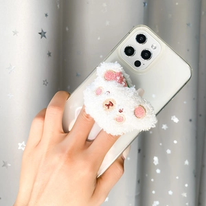 Close-up of cute white plush bear phone grip with integrated flip mirror for makeup
