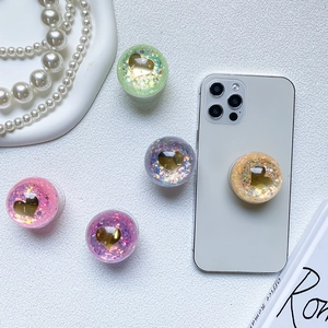 Sparkly heart popsocket set with colorful glitter and 3D gold accents for smartphone