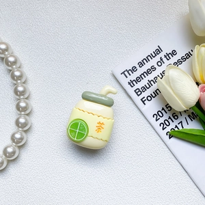 Close-up of a cute lemon tea resin phone grip with green straw and citrus slices