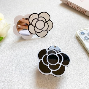 Macro view of camellia flower folding portable mirror stickers in black and white