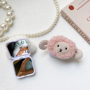 Detailed view of foldable lilac makeup mirror with cute pink plush lamb and dual mirrors