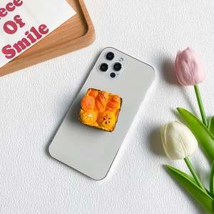 3D realistic bread basket phone grip with croissants and baguettes on a silver phone
