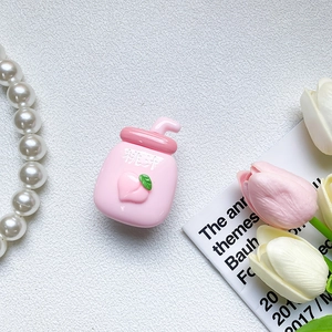 Cute pink peach juice bottle phone grip with textured resin flower decor details