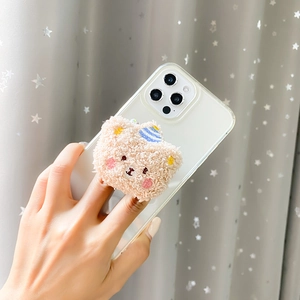 Detail of cute plush bear phone socket with mirror and blue striped hat on a clear case