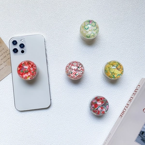 3D fruit resin pop sockets featuring strawberry, lemon and watermelon slices on white texture