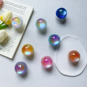 Collage of eight laser glitter phone socket stands with iridescent aurora galaxy finish