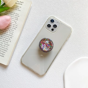 Sparkling crystal ball phone socket with colorful sequins on a clear protective case