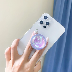 Detail of a purple laser holographic glitter phone socket holder on a white smartphone