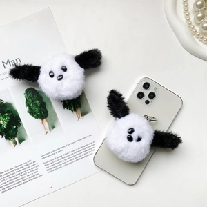 Cute plush puppy panda phone grip holder with fluffy texture on white smartphone