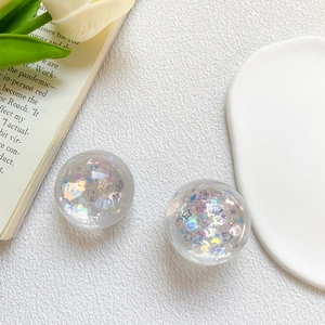 Detail view of 3D crystal resin phone grip with colorful sequins and aurora shell flakes