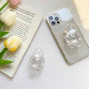 Macro view of clear astronaut phone socket on a transparent case with acrylic crystal finish