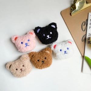 Set of five plush cartoon bear socket stands in various colors with a sherpa texture