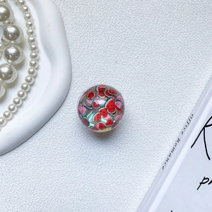 Detailed macro view of a 3D resin watermelon sphere for a retractable phone socket grip