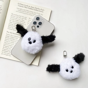 Cute panda puppy plush phone charm with metallic lobster clasp in lifestyle scene