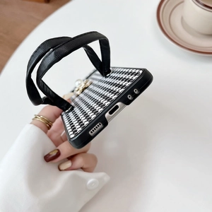 Detail of houndstooth phone case with leather strap and pearl charms for Samsung ZFlip