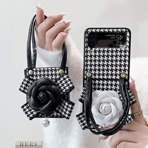 Samsung Galaxy Z Flip case featuring houndstooth pattern and large 3D flower with handle