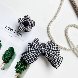 Houndstooth flower and bow phone socket grip stand set with textured fabric finish