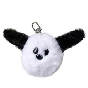 Cute plush dog phone stand with a black and white furry design and metal keychain hook