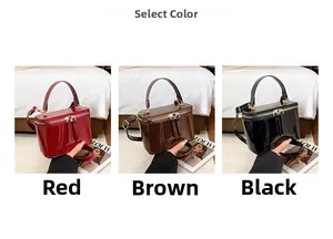 Three square top-handle handbags in glossy red, coffee and black with metal zippers